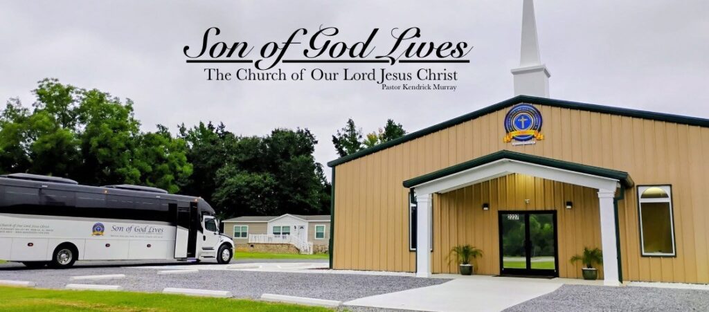 Church building of "Son of God Lives" with a bus parked nearby. The structure has a prominent steeple and is surrounded by greenery, emphasizing its welcoming atmosphere.